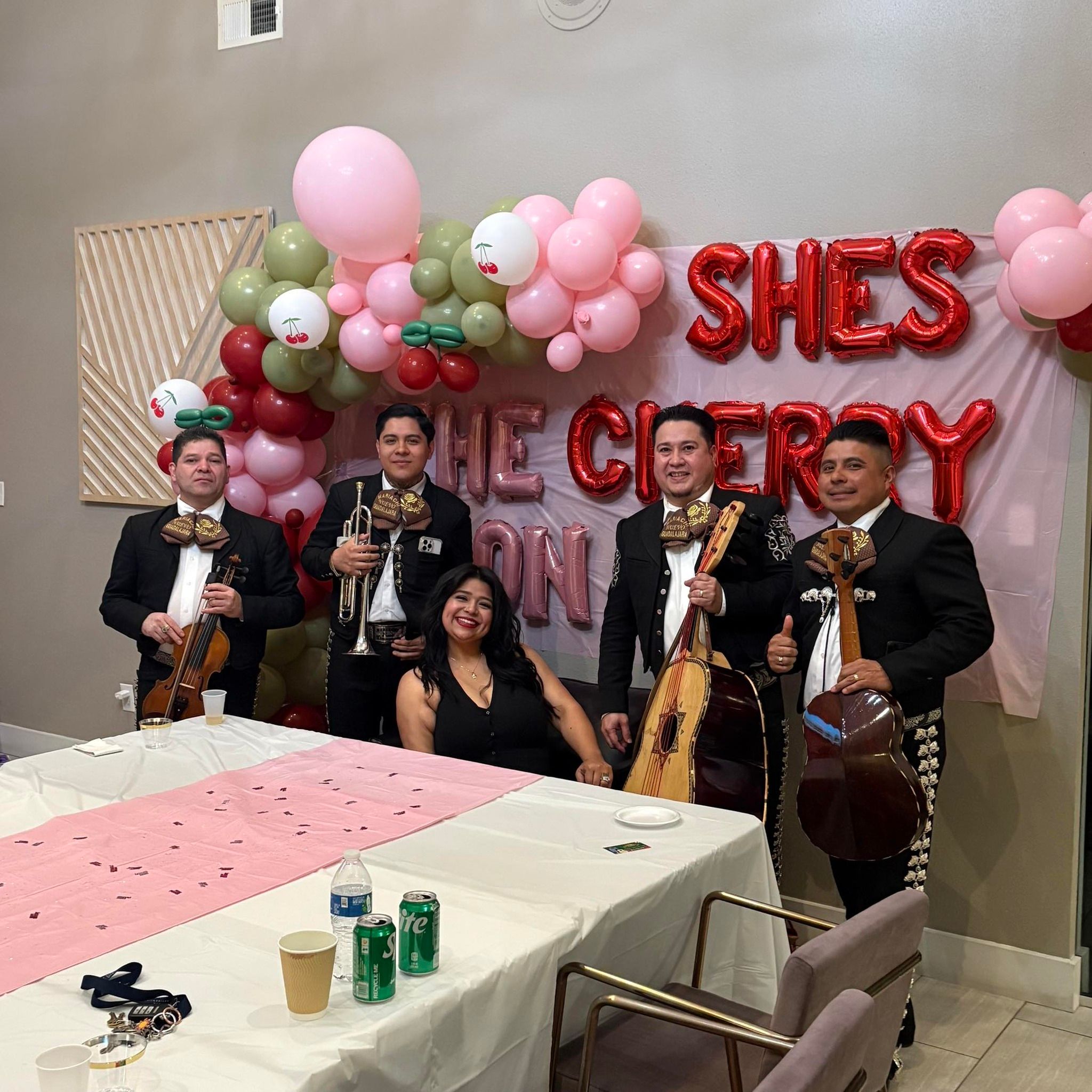Mariachi musicians at a birthday gathering.